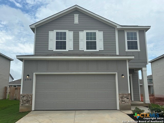 view of front of property with a garage