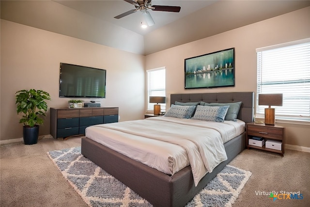 carpeted bedroom with lofted ceiling and ceiling fan