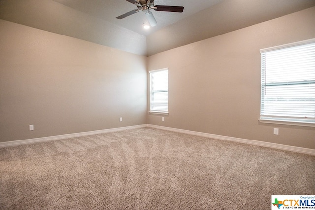 unfurnished room with ceiling fan, vaulted ceiling, and carpet floors