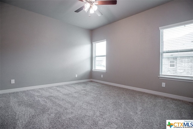 empty room featuring carpet and ceiling fan