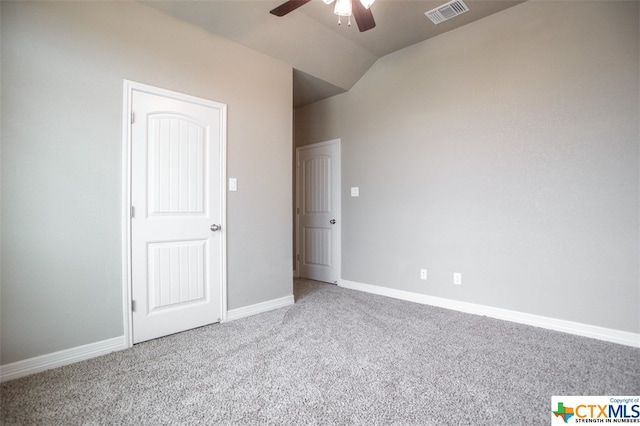 unfurnished bedroom featuring carpet floors, ceiling fan, and vaulted ceiling