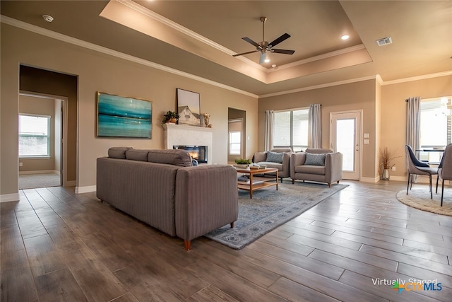 living room with a wealth of natural light and hardwood / wood-style flooring