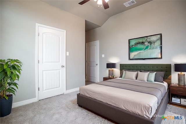 bedroom featuring ceiling fan, light carpet, and lofted ceiling