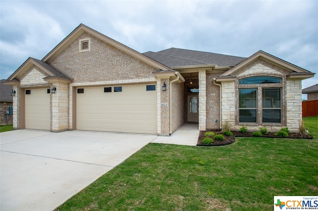 view of front facade with a garage and a front lawn