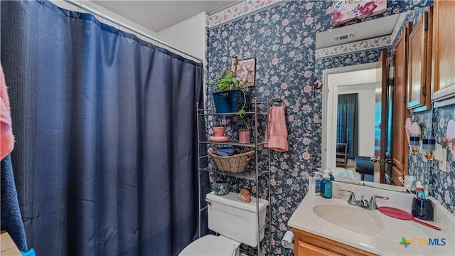 bathroom with vanity and toilet