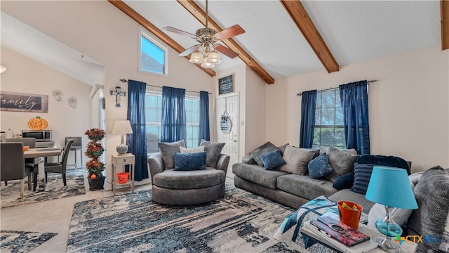 living room with a textured ceiling, high vaulted ceiling, ceiling fan, and beam ceiling