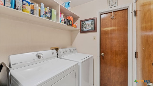 washroom with washer and dryer