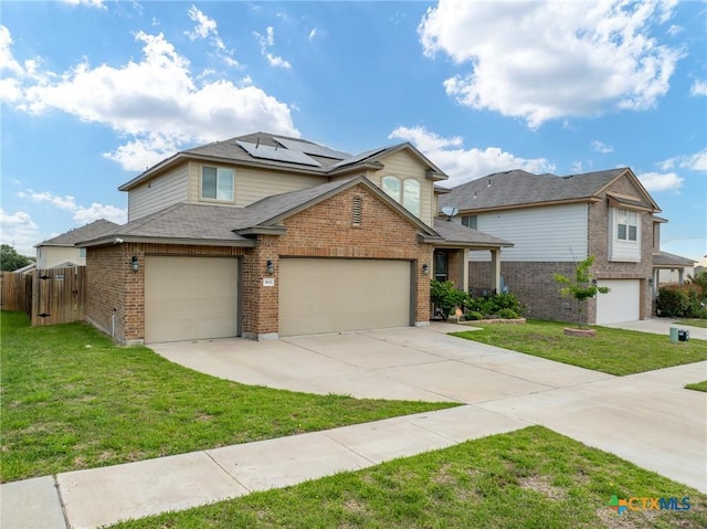 traditional home with brick siding, solar panels, concrete driveway, a gate, and roof with shingles
