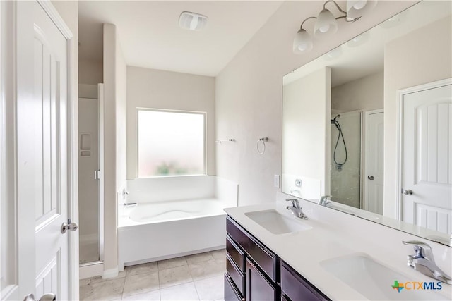 full bath with a shower stall, a bath, double vanity, and tile patterned flooring