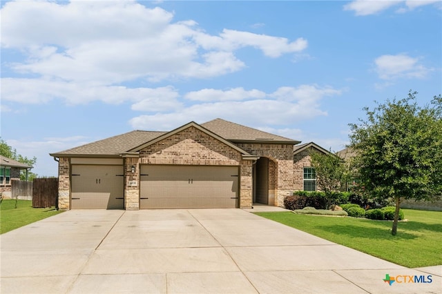 6038 Ballast Trl, New Braunfels, TX 78132 - view of front of home featuring driveway, a garage, brick siding, and a shingled roof