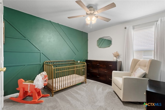 6038 Ballast Trl, New Braunfels, TX 78132 - bedroom featuring a nursery area, carpet, and a ceiling fan