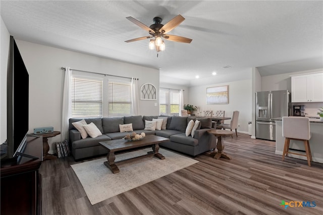 6038 Ballast Trl, New Braunfels, TX 78132 - living area with dark wood-style floors, ceiling fan, and recessed lighting