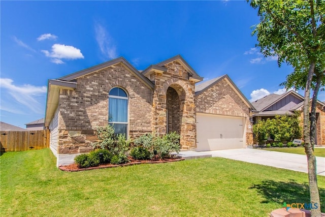 view of front of house with a garage and a front lawn