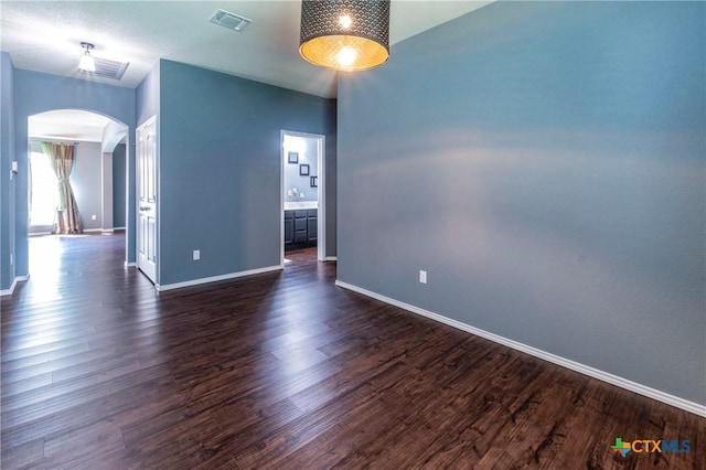 unfurnished room with dark hardwood / wood-style floors