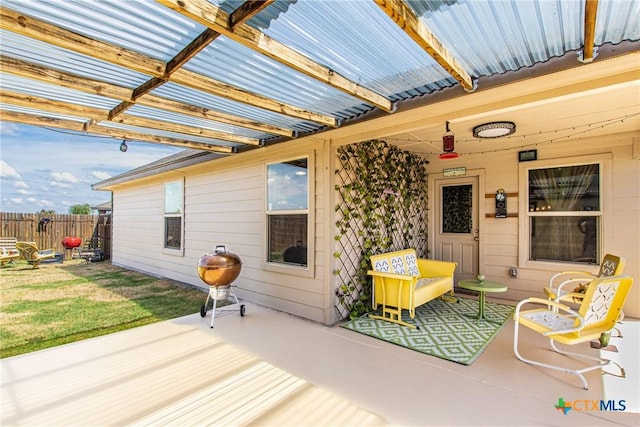 wooden terrace with a patio area and a pergola