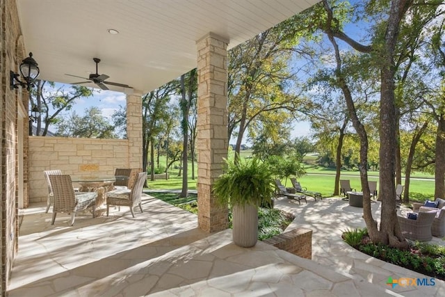 view of patio / terrace featuring ceiling fan