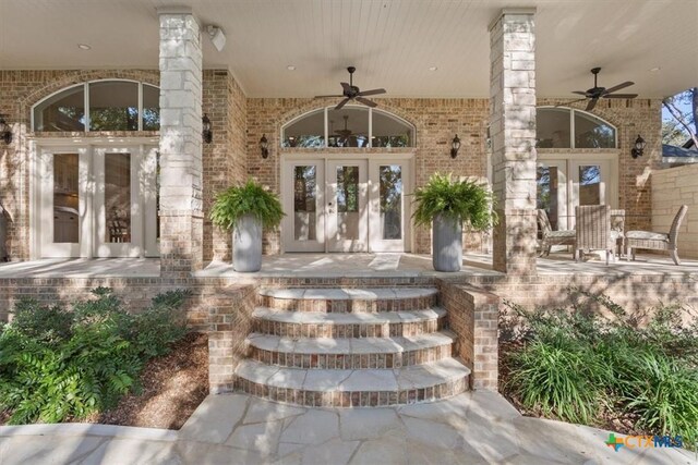 view of exterior entry featuring french doors and ceiling fan