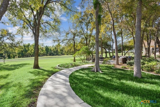 view of home's community featuring a yard