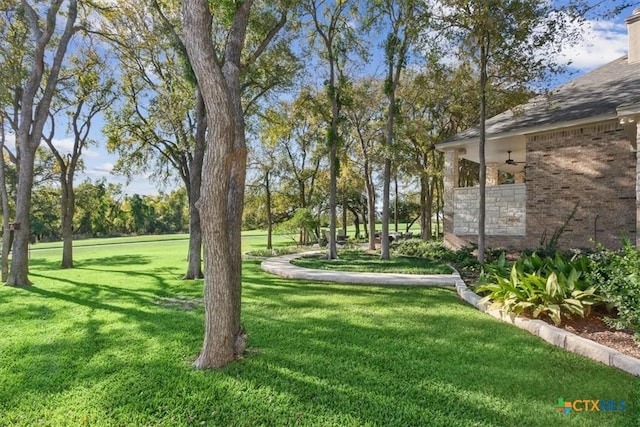 view of yard featuring ceiling fan