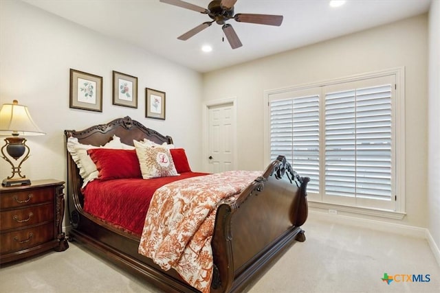 carpeted bedroom with ceiling fan