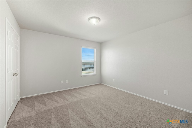 empty room with light colored carpet