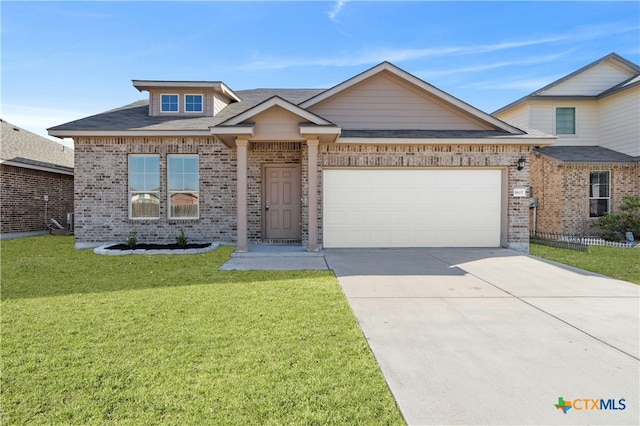 view of front of house featuring a front yard and a garage