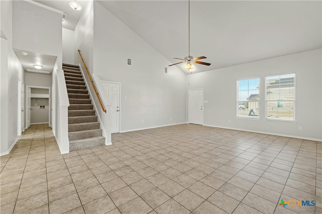 unfurnished living room with high vaulted ceiling, ceiling fan, and light tile patterned flooring