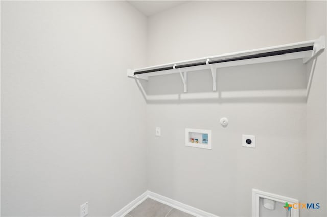 clothes washing area with hookup for an electric dryer, washer hookup, hookup for a gas dryer, and tile patterned floors