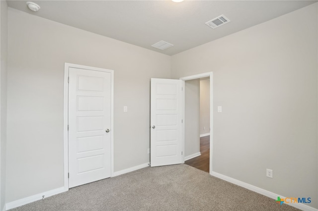 unfurnished bedroom featuring carpet