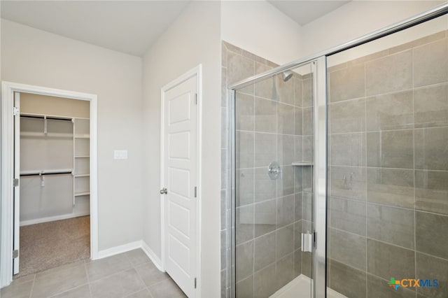 bathroom featuring tile patterned flooring and walk in shower