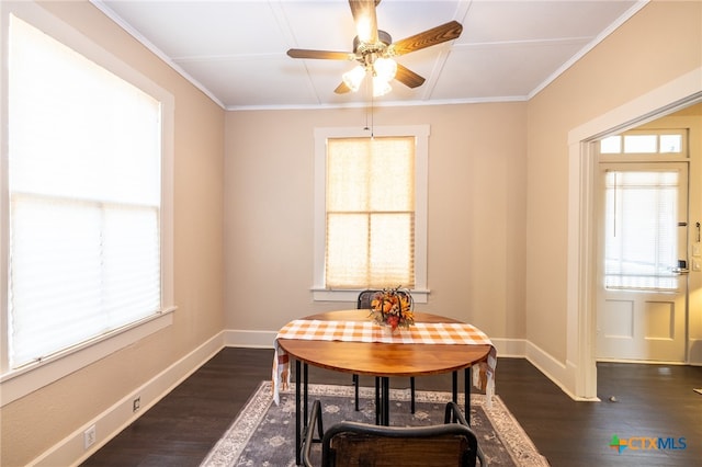 dining area with dark hardwood / wood-style floors, ceiling fan, and ornamental molding