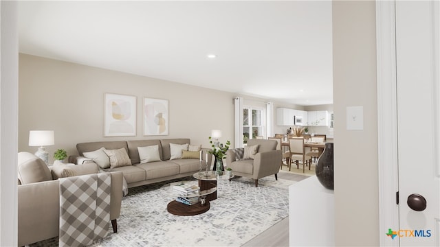 living area featuring recessed lighting and light wood-style floors