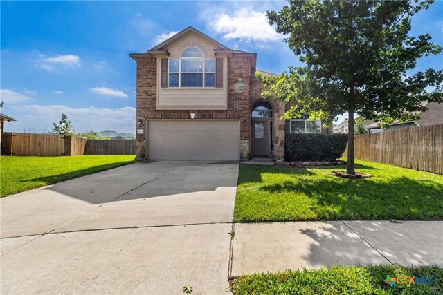 4805 Farrell Ln, Killeen, TX 76549 - traditional-style house with a garage, brick siding, and driveway