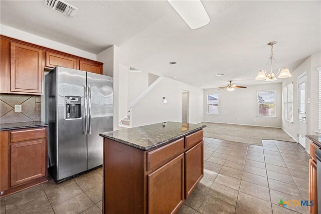 4805 Farrell Ln, Killeen, TX 76549 - kitchen featuring stainless steel fridge, tile patterned flooring, a ceiling fan, a kitchen island, and carpet floors