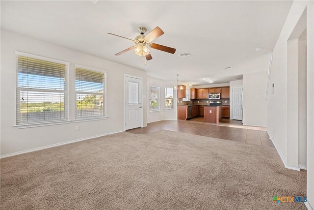 4805 Farrell Ln, Killeen, TX 76549 - unfurnished living room with light carpet, ceiling fan, and light tile patterned floors