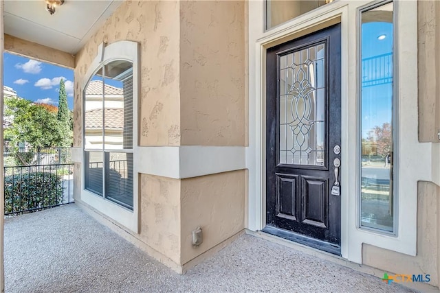 entrance to property with a balcony