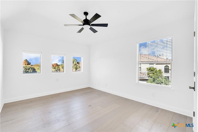 unfurnished room with ceiling fan and light hardwood / wood-style flooring