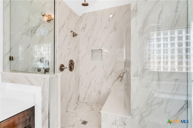 bathroom featuring tiled shower