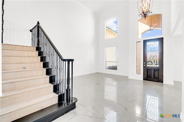 foyer with a notable chandelier