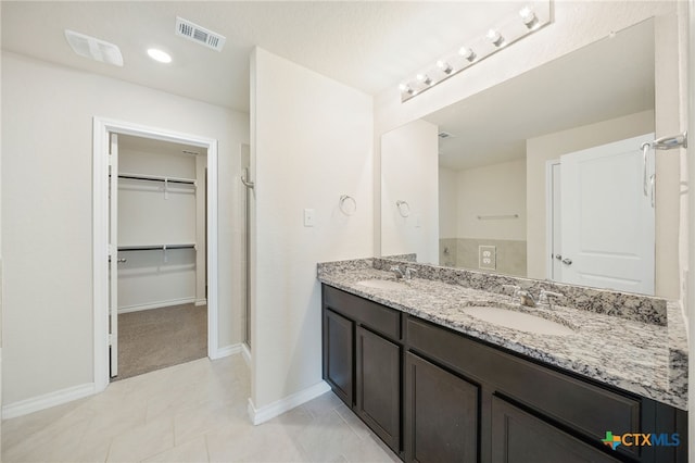 bathroom featuring tile patterned floors and vanity