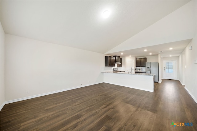 unfurnished living room with sink, high vaulted ceiling, and dark hardwood / wood-style floors