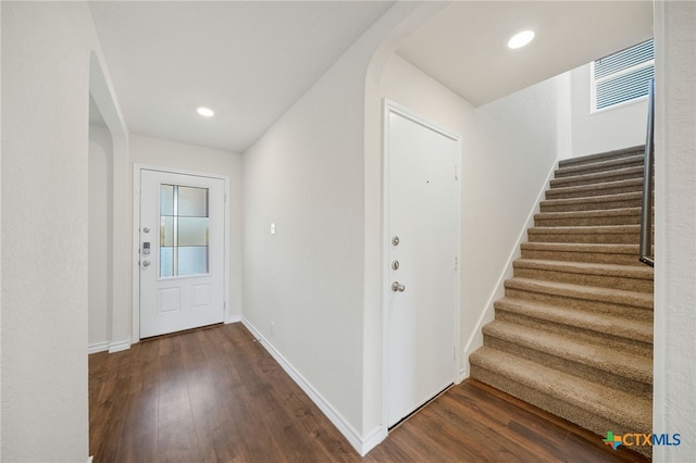 foyer with dark hardwood / wood-style flooring