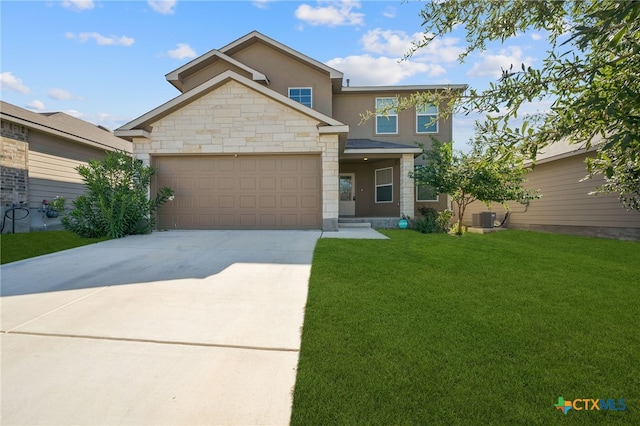 view of front of property featuring a front lawn, a garage, and central AC