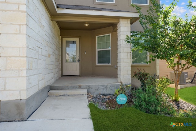 entrance to property featuring central AC