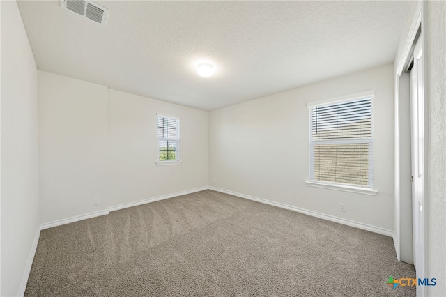 empty room with carpet flooring