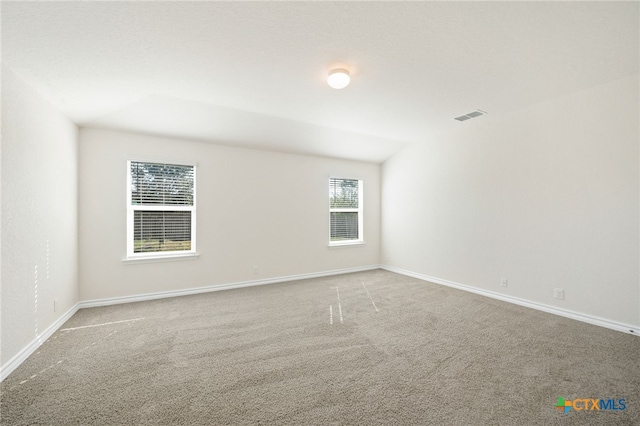 unfurnished room featuring carpet