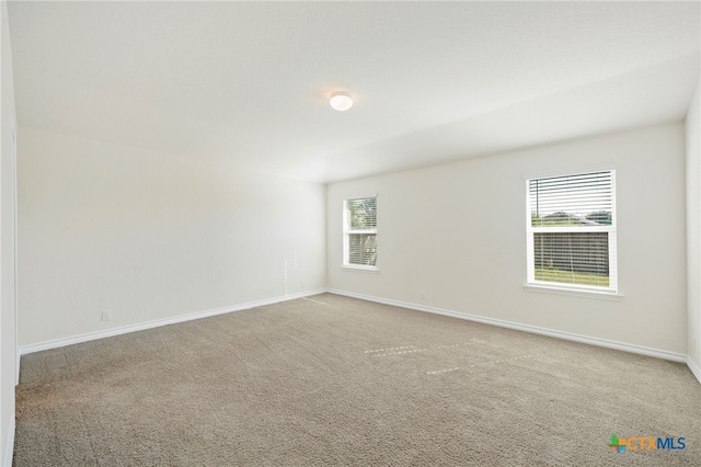 unfurnished room with carpet flooring