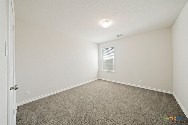 unfurnished room featuring carpet flooring