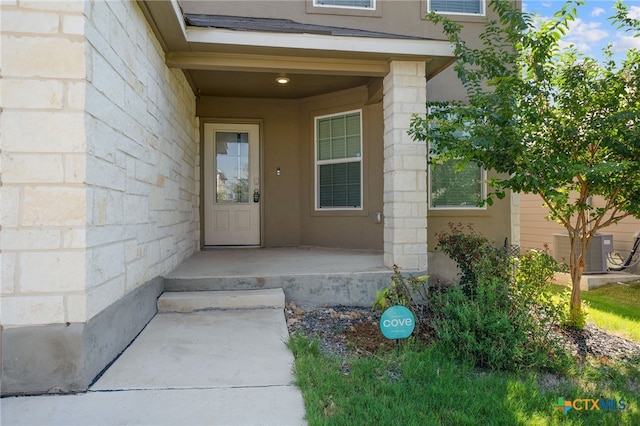 doorway to property with central AC