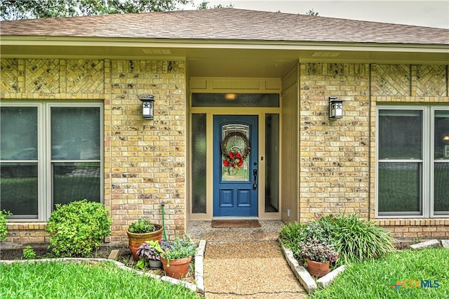 2702 Olympia Dr, Temple, TX 76502 - entrance to property featuring brick siding and roof with shingles